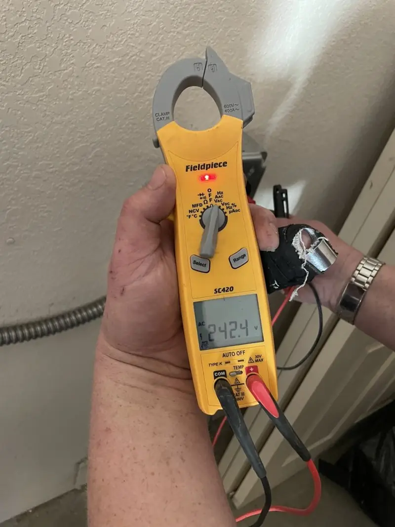 Voltage testing with clamp meter during Aluminum Wiring Replacement in Beach City